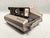 A vintage Polaroid Spectra camera that includes a remote, transmitter, manual, and case. The Instant Spectra camera was...