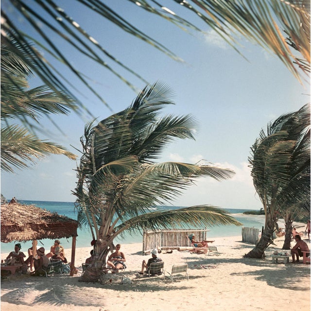Mill Reef Club by Slim Aarons Guests relax on the beach at the Mill Reef Club in Antigua in the West Indies, 1960. (Photo...