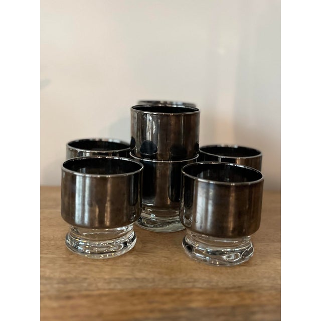 An octet of mid-century bar flare. A perfect gift for the collector or for your own bar top.