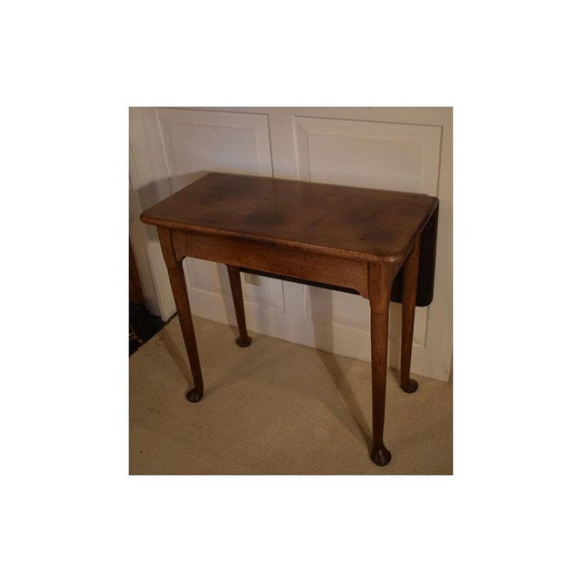 Small Georgian walnut single drop leaf table from the late 1700s. This could work as a breakfast table in a tight spot or...