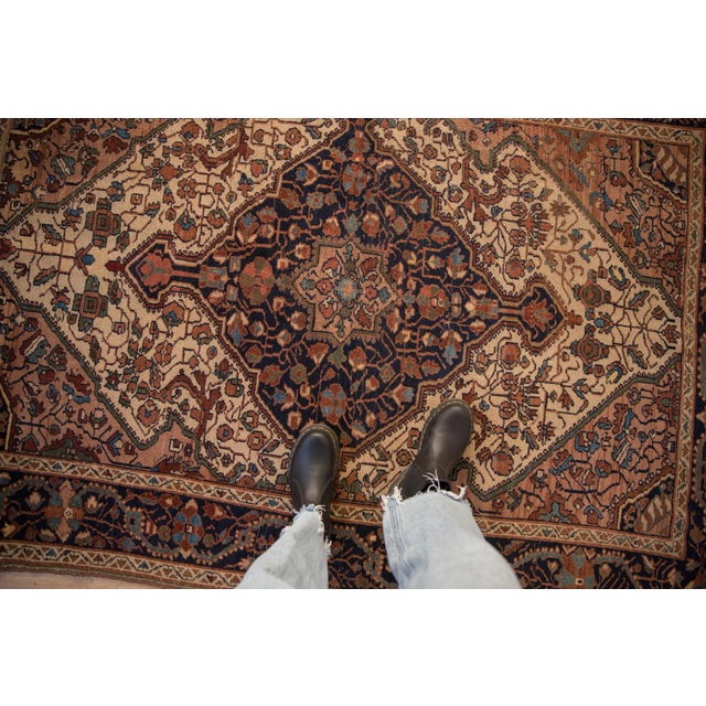 :: Oversized center medallion atop a covered field of vines interconnecting with scrolled arabesques, floral blossoms, and...