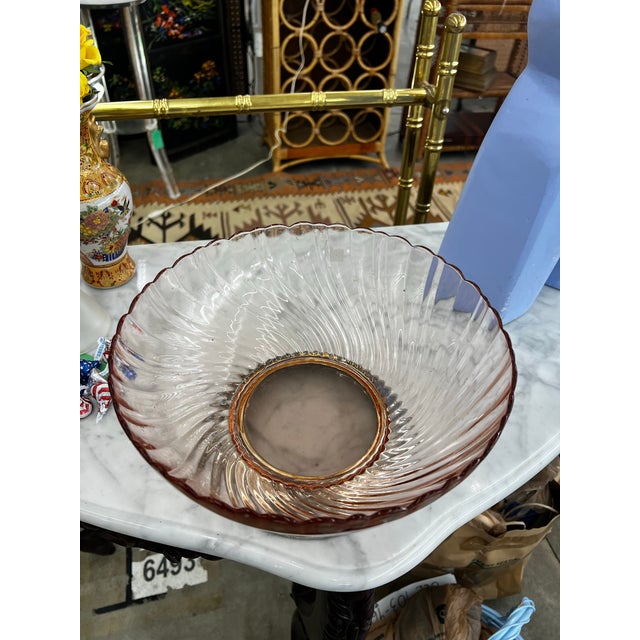 Up for consideration is a beautiful vintage pink depression glass bowl with a silver footed base. This would look lovely...