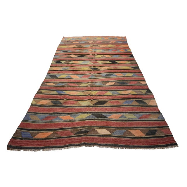 Vintage handwoven kilim rug from Kars region of Turkey. Approximately 55-65 years old. In very good condition.