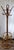 This is a vintage mid-century bamboo and rattan standing coat rack featuring a distinctive circular umbrella holder near...