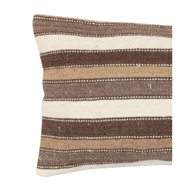 Add a touch of history and warmth to your space with this vintage handmade Turkish wool kilim cushion cover. Crafted from...