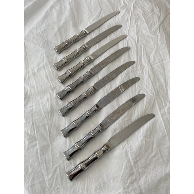 Heavy set of 8 supreme stainless steel knives in a bamboo design.