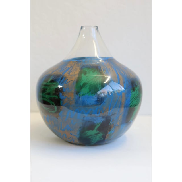 Large, mouth blown, studio glass vase. Features shapes of some continents and three words: one, chance and world....