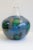 Large, mouth blown, studio glass vase. Features shapes of some continents and three words: one, chance and world....