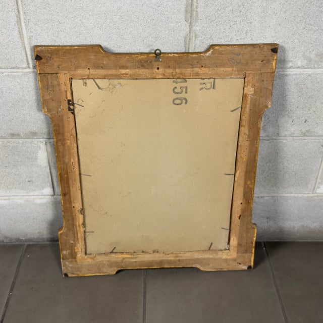 A striking and dramatic wall frame with an internal oval mirror in richly gilded wood, a fine piece of furniture in the...