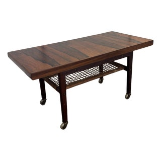 Scandinavian Indonesian Rosewood Coffee Table on Wheels with Magazine Rack, 1960s For Sale
