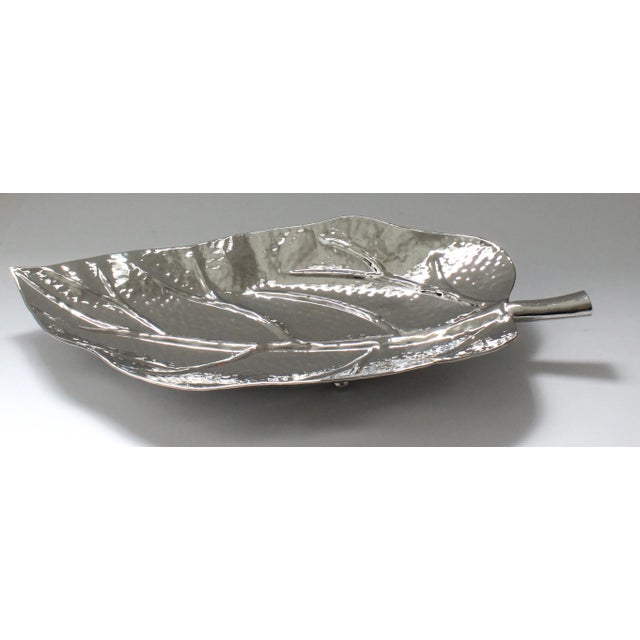 This stylish and chic nickel plated serving dish in the form of a leaf was created by Iconic Snob Galeries, and it will...