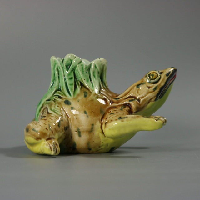 Holdcroft Majolica toothpick holder which features a frog under some leaves which form the vase. Colouration: green,...