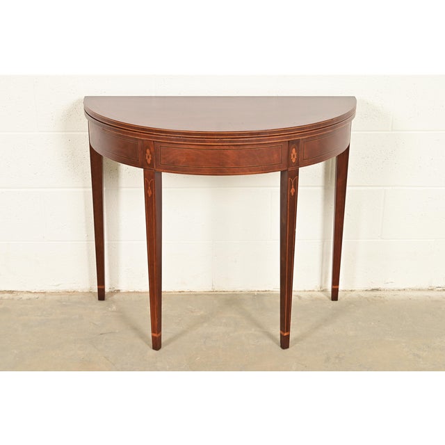 A gorgeous Federal or Hepplewhite style flip-top demilune console, entry table, or game table By Baker Furniture USA,...