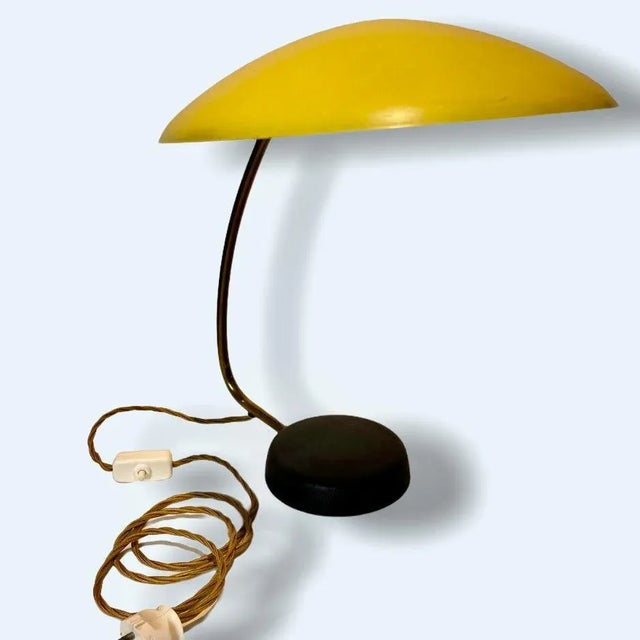 50s table lamp from cosack leuchten material: metal partly brass, lamp base and shade original paint the lampshade is...