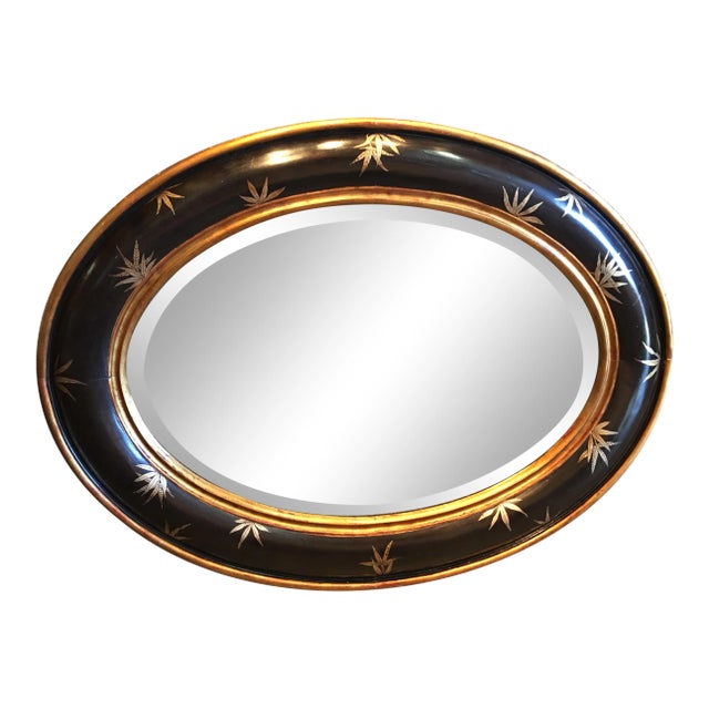 Chinoiserie Gold Bamboo Leaves on Convex Black Frame With Antiqued Oval Smoky Mirror For Sale