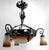 Art Deco Chandelier in Wrought Iron and Blown Glass by Muller Frères Lunéville, France, Circa 1920. We are pleased to...