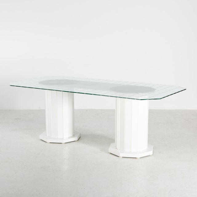German dining table with column-like plastic legs and angular glass top from the 1970s, produced by Werzalit. with several...
