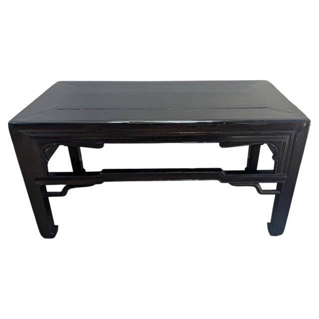 Antique Chinese Coffee Tea Table of the late 19th century Qing dynasty. Black lacquered low table with scalloped aprons,...