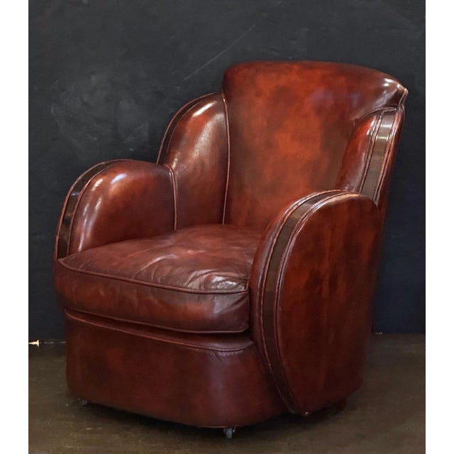 A fine vintage French leather upholstered club or lounge chair from the Art Deco era - featuring a comfortable shaped back...