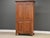A solid cherry tall armoire dresser with exposed dovetails very well made. Professionally restored. Circa 1990’s. Made in...