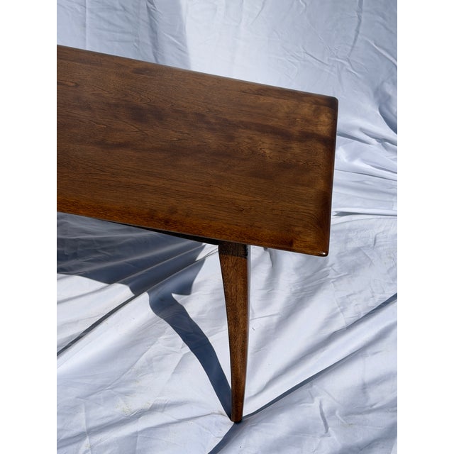For sale is a heywood wakefield walnut wood coffee table.