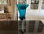 Here is a spectacular vase which includes a Korean feather base and a Murano turquoise glass bowl. Item is secured with...