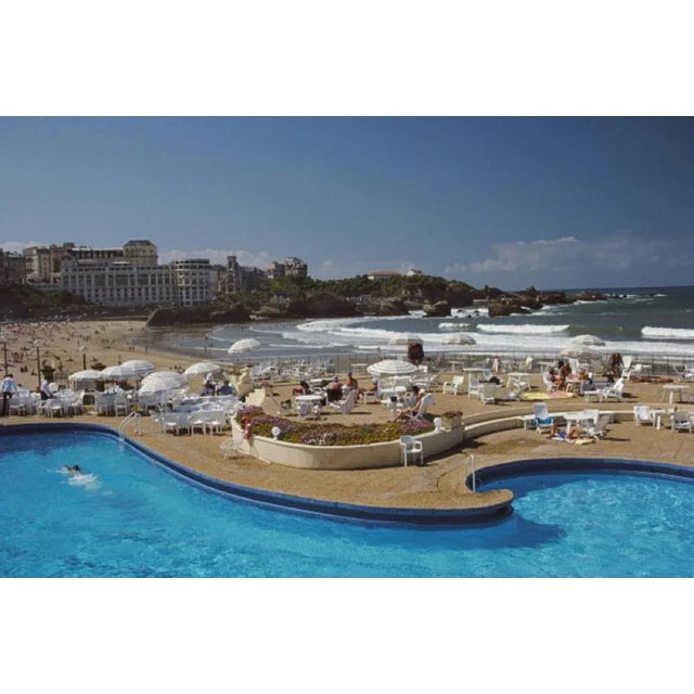 Hotel Du Palais Biarritz 1985 by Slim Aarons Slim Aarons Limited Estate Edition The curved beachside pool at the Hotel du...
