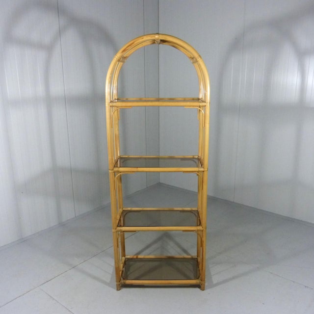 Very nice rack / display. Rattan frame with 4 smoked glass shelves. 1970’s. In very good condition. H174XW65XD35 cm.