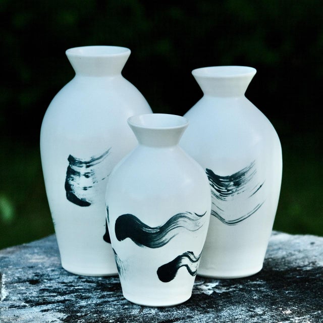 "Stoneware vase, wheel-thrown from white stoneware and coated with "Satin White Liner" and "Charcoal" glazes. Brand:...