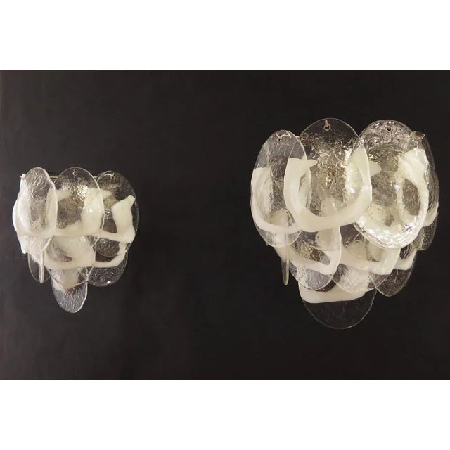 Pair of Italian vintage Murano wall lights made by 10 glass leaves for each applique in a chrome frame. The originality of...