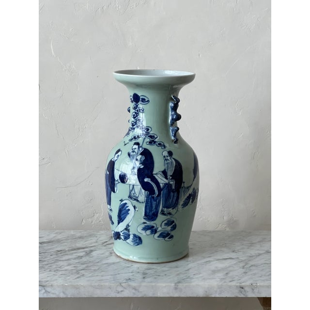 19th Century Chinese porcelain vase finished in a celadon glaze. Blue and white style with hand painted figures and...