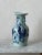 19th Century Chinese porcelain vase finished in a celadon glaze. Blue and white style with hand painted figures and...