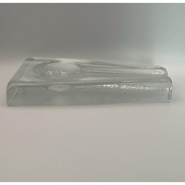 Stunning Mid Century Modern glass cigar ashtray handmade in glowing clear glass. Glossy finish, produced c. 1960 using...