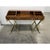 Campaign style desk designed by John Van Koert for Drexel. The desk is supported by gold crossed wood supports with a gilt...