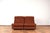 This set of 2 Italian armchairs from the 70s that can be combined to form a two-seater sofa by using metal handles located...