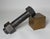 Large 1930's nut and bolt on a brass plinth. Forged of iron, not cast. Bolt is 13-1/2" long and weighs 20+ lbs. An amazing...