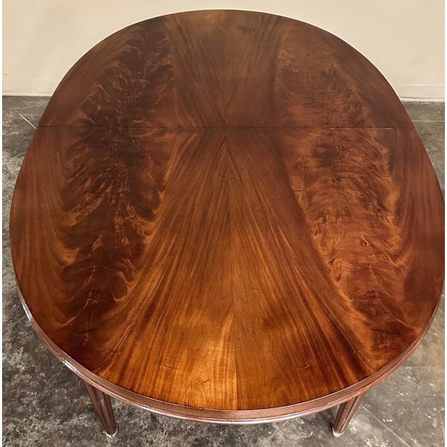 This antique Louis XVI oval table is the perfect size for a group of six. Hand-crafted from exotic imported mahogany, the...