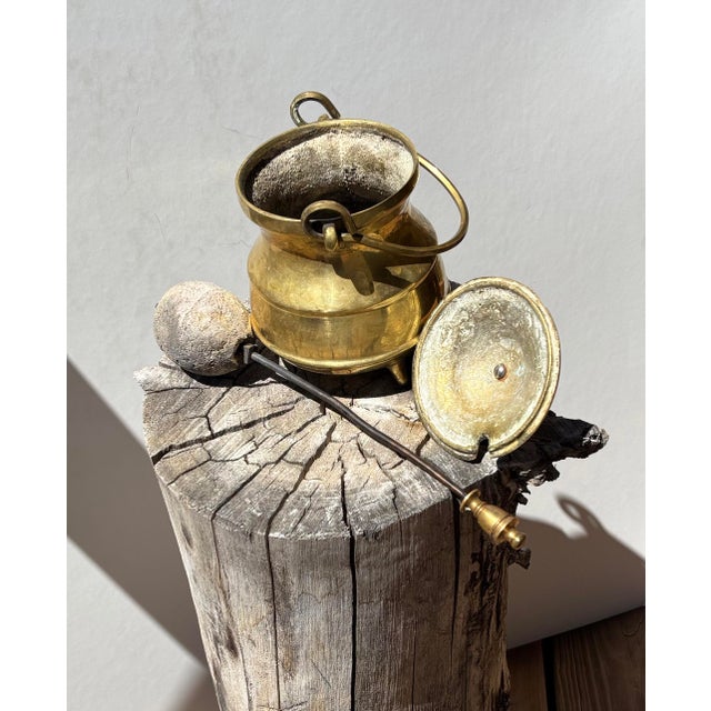 Vintage brass Cape Cod style fire starter. Pot to hold kerosene; lid; metal wand ending in pumice ball to absorb kerosene....