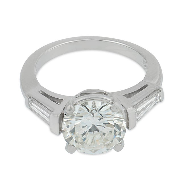 A timeless and elegant vintage diamond ring, this refined design centers on a magnificent 2.18 carat round brilliant cut...
