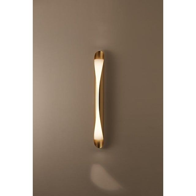 Oblong cocon pendant lamp by jennifer midoz dimensions: d 80 x w 11 x h 80 cm materials: gold polished brass and lacquered...