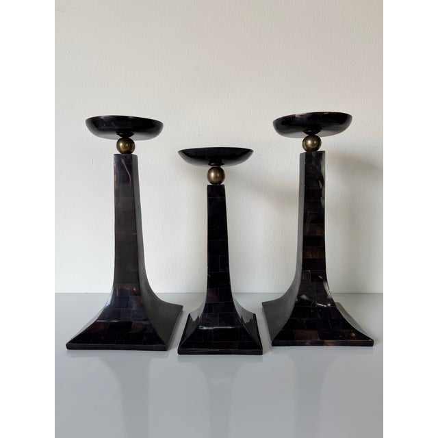 Elegant vintage Maitland Smith–style candle holders crafted with tessellated horn veneer and accented with solid brass...