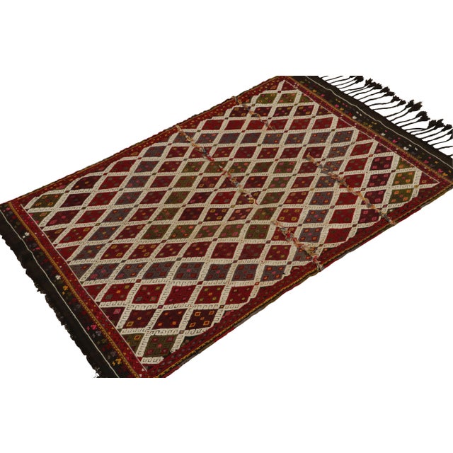 Hand-knotted in wool, a 4x6 vintage Tulu tribal rug drawing on Turkish kilim geometric sensibilities. Originating from...