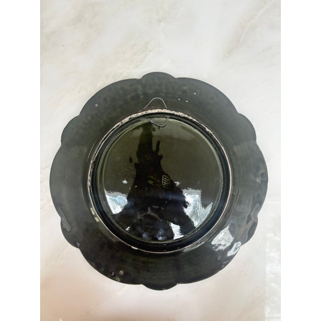 Footed French barbotine majolica charger with raised, hand-painted decoration depicting Joan of Arc mounted on a white...