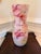 Striking decorative art glass vase featuring a dreamy, watercolor-like abstract pattern in layered shades of blush pink,...