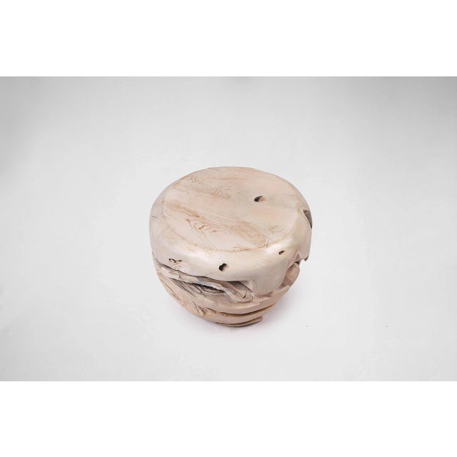 Inspired by the beauty of natural root form, this organic teak accent side table is handcrafted from one piece of salvaged...