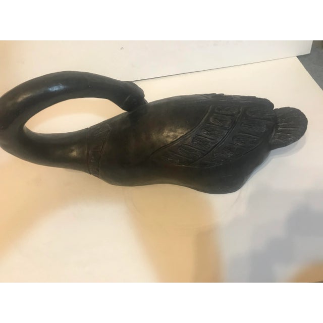 A Vintage 1981 faux bronze sculpture of a long neck goose. Signed and dated by Austin Productions 1981. This is a great...