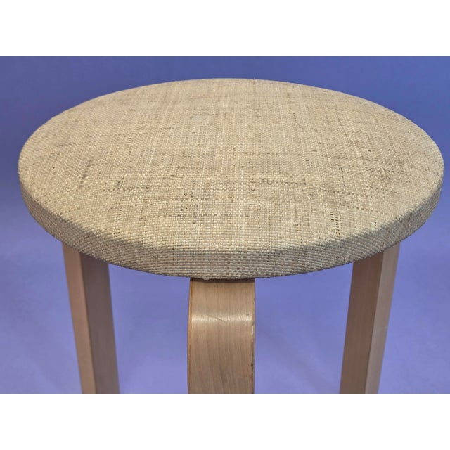 Artek stool 60. Birch with beige reed upholstery. The stool dates from around the 1960s and is in good, used condition....
