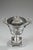 Slightly tapered candy dish in silver and crystal. The rim is ornamented with an openwork geometric frieze, and the paunch...