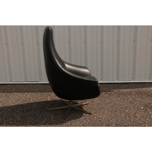 This tall, Danish-style lounge chair is on a swivel base and is remarkably comfortable.