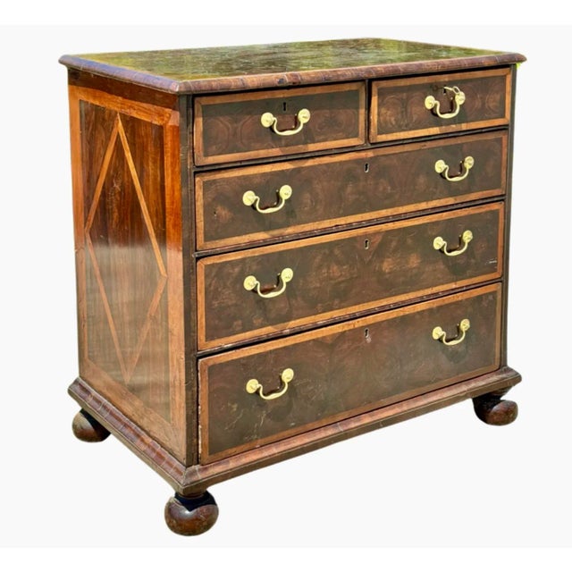18th century William and Mary burl cross-branded oyster veneered walnut chest of drawers. Chest features two short drawers...